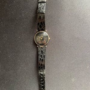 Paul Peugeot gold watch with a black dial and simulated black snakeskin band